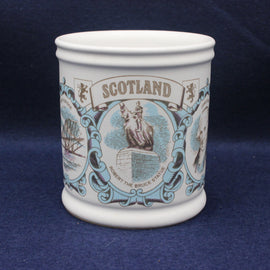 Ceramic mug with decorative design and 'Scotland' text on a blue background