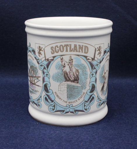 Ceramic mug with decorative design and 'Scotland' text on a blue background