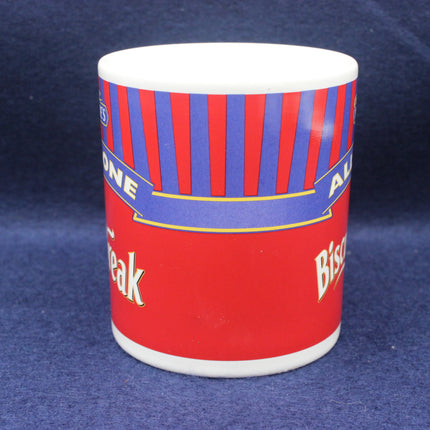 Red mug with blue and white striped pattern on a blue background