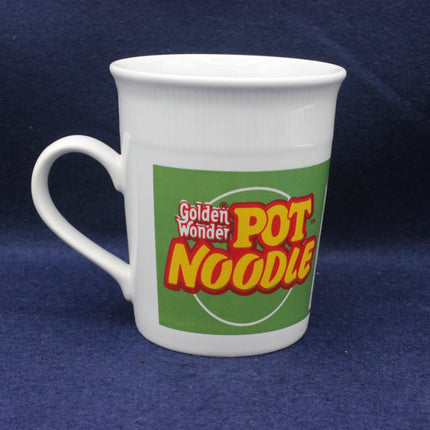 White mug with Golden Wonder Pot Noodle logo on a blue background