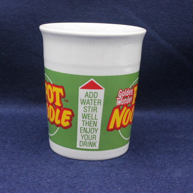 White cup with a colorful label on a blue background