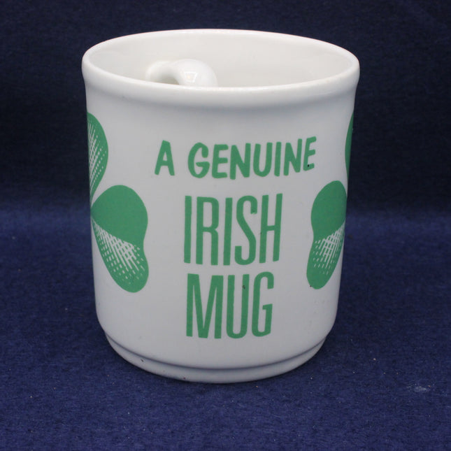 White mug with green text 'A Genuine Irish Mug' on a blue background