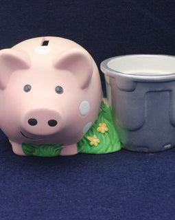 Pink piggy bank with a gray cup on a blue background