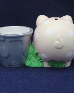 Pink piggy bank with white polka dots and green feet on a blue background