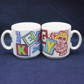 Two mugs with colorful designs on a blue background