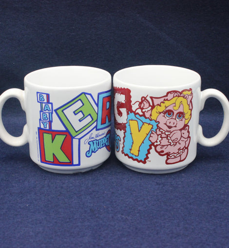 Two mugs with colorful designs on a blue background