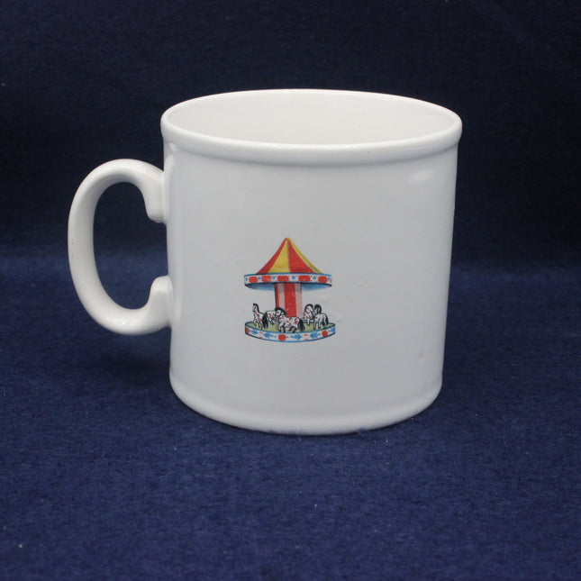 White mug with a colorful carousel design on a dark blue background