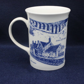 White mug with blue architectural design on a dark blue background