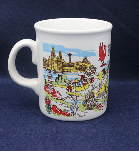 White mug with colorful illustrations of a cityscape and landmarks on a blue background
