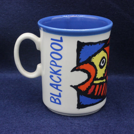 Mug with a colorful fish design and 'Blackpool' text on a blue background