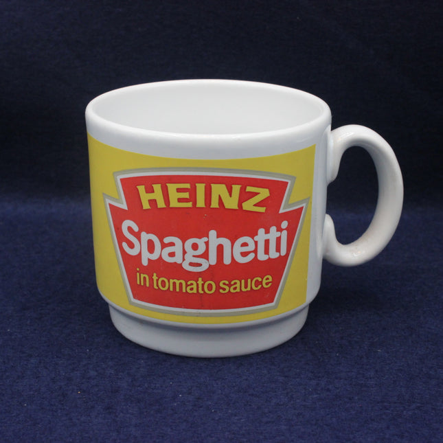 Mug with Heinz Spaghetti in tomato sauce label on a dark blue background