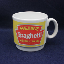 Mug with Heinz Spaghetti in tomato sauce label on a dark blue background