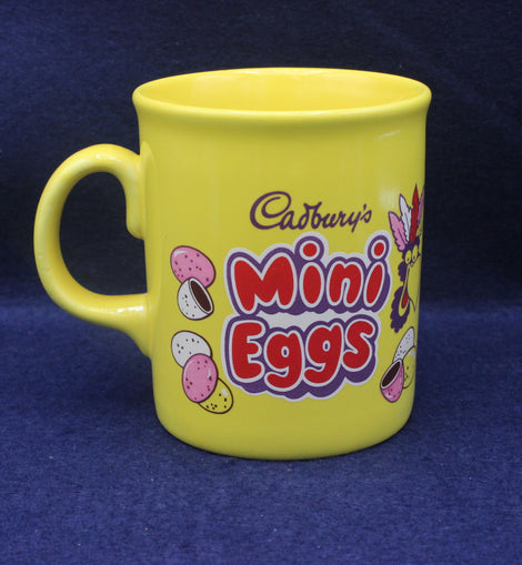 Yellow mug with Cadbury's Mini Eggs branding on a blue background