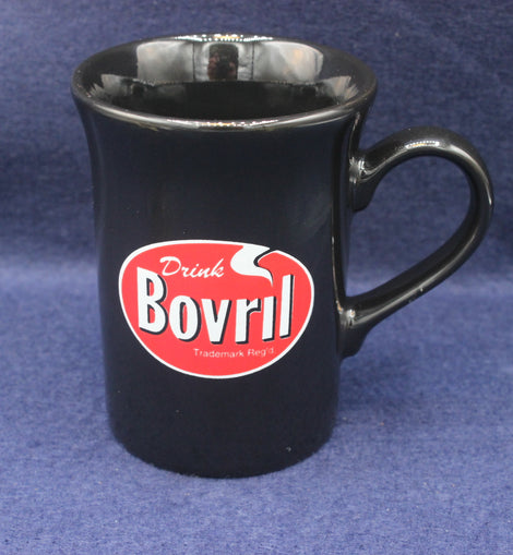 Black mug with Bovril logo on a blue background