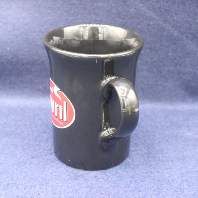 Black mug with a red logo on a blue textured background