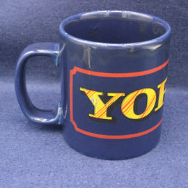 Blue mug with 'YORKIE' text on a blue background