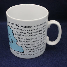 White mug with text and blue illustration on a dark background