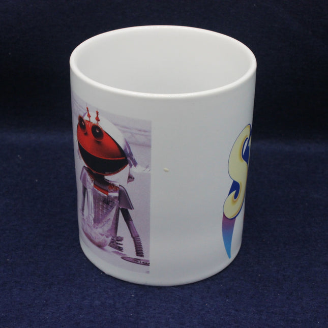 White mug with a robot design on a dark blue background