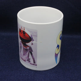 White mug with a robot design on a dark blue background