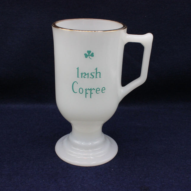 White mug with 'Irish Coffee' text and shamrock on a dark background