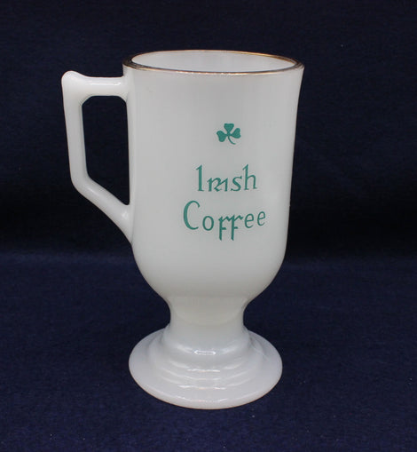 White mug with 'Irish Coffee' text and shamrock on a dark background