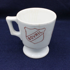 White mug with Bovril logo on a dark blue background