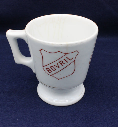 White mug with Bovril logo on a dark blue background