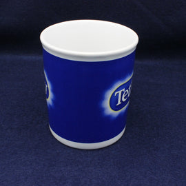 Blue mug with a white lid on a dark blue background