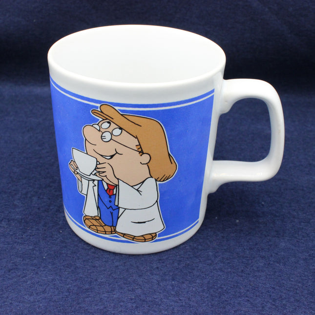 White mug with cartoon Tetley character on a blue background