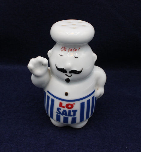 Ceramic salt shaker shaped like a chef with 'LO SALT' on a dark background