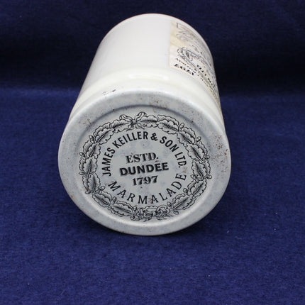 Glass jar with branding the lid on a blue background