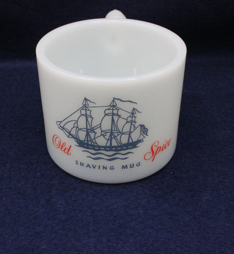 White shaving mug with ship design and 'Old Spice' text on a dark blue background