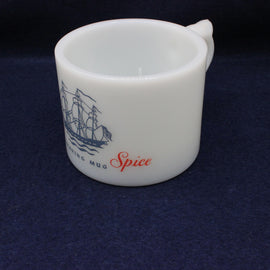 White mug with ship design and 'Spice' text on a dark blue background