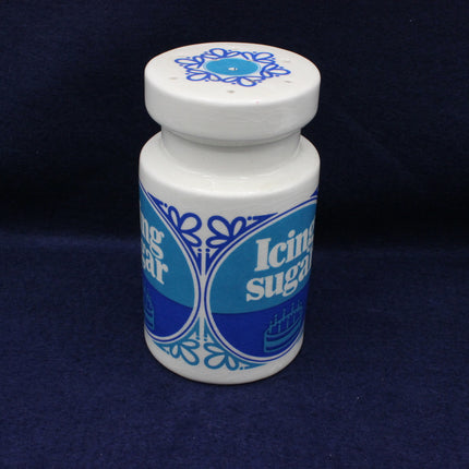 White container with blue decorative design and text on a dark blue background