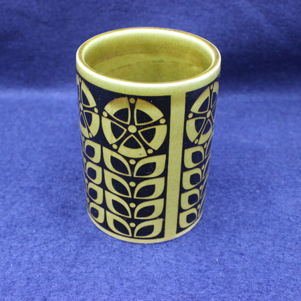 Ceramic vase with a geometric pattern on a blue background