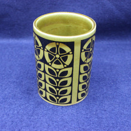 Ceramic vase with a geometric pattern on a blue background