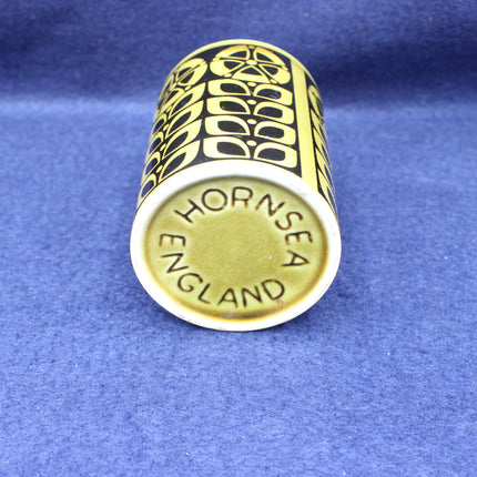 Gold thimble with 'Hornsea England' engraving on a blue background