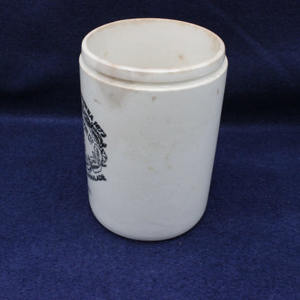 White ceramic cup with a logo on a blue background
