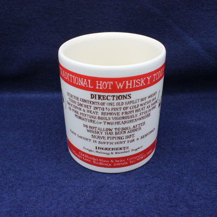 White mug with red text on a blue background