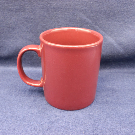 Red mug on a gray background