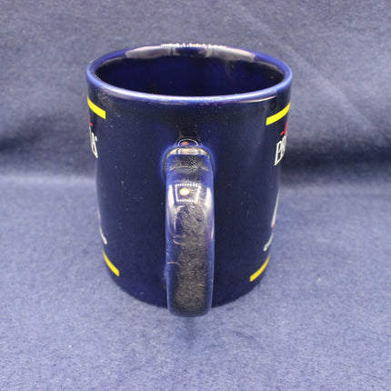 Blue mug with a handle on a gray background