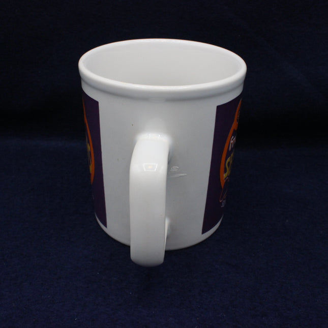 White mug with a logo on a dark blue background