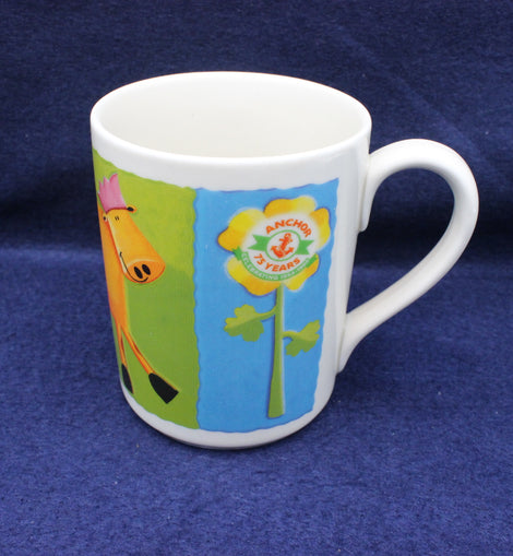 White Anchor Butter mug with colorful design featuring a cow and floral elements on a blue background