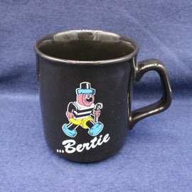Black mug with Bertie Basset image on a blue background