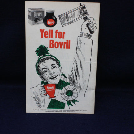 Vintage Bovril advertisement with a woman holding a cup and a hand holding a bottle, on a dark background.