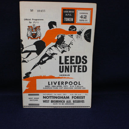 Vintage sports program for Leeds United vs Liverpool match on a dark background