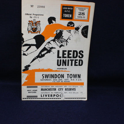 Vintage football match programme for Leeds United vs Swindon Town on a dark background