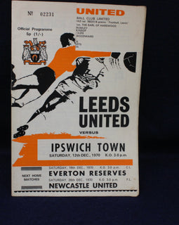 Vintage football match programme for Leeds United vs Ipswich Town, featuring black and white illustrations on a dark background.