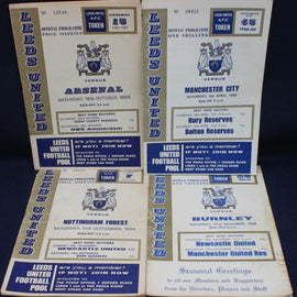 Collection of Leeds United football match programs from various matches.