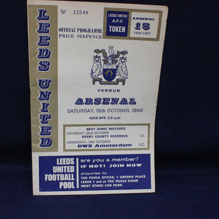 Vintage Leeds United vs Arsenal football programme from 1966 on a dark background
